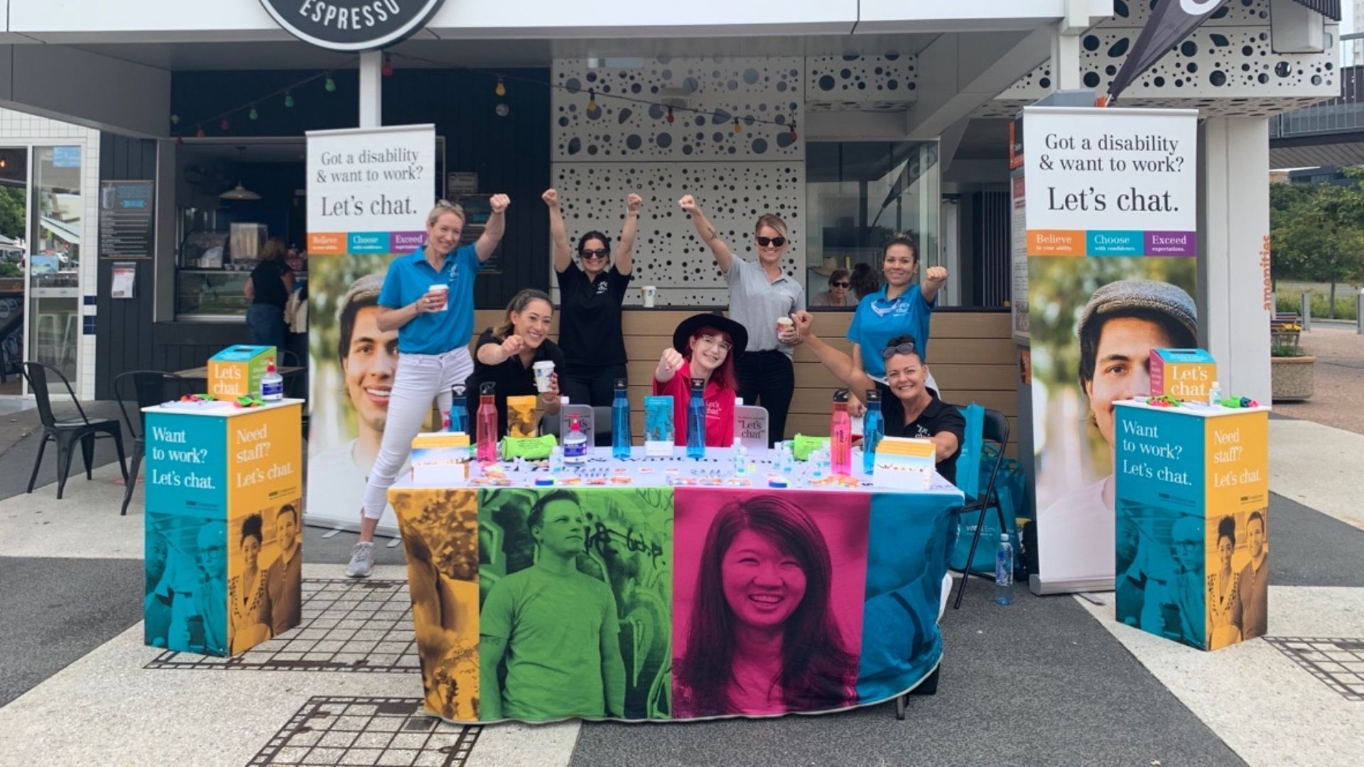 WISE team at an event outside a cafe