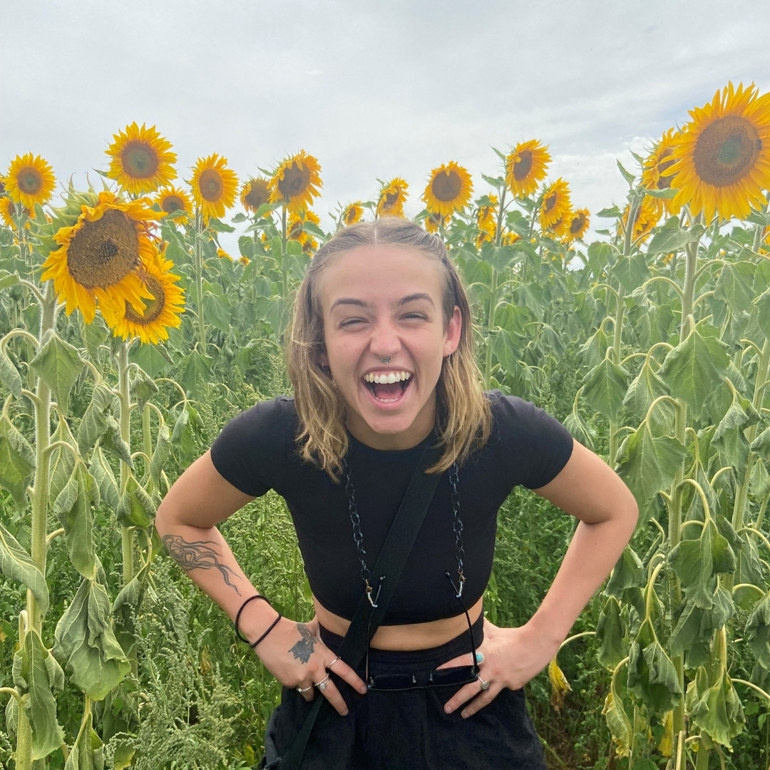 Tecia standing in the sunflower fields
