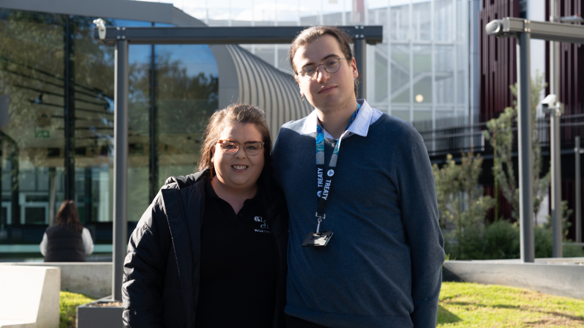 Robert and Christine standing next to eachother, smiling at the camera