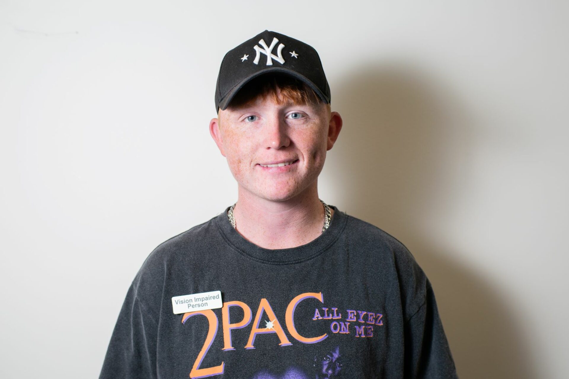 Smiling young vision impaired man.