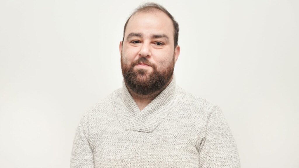 A man smiling at the camera.