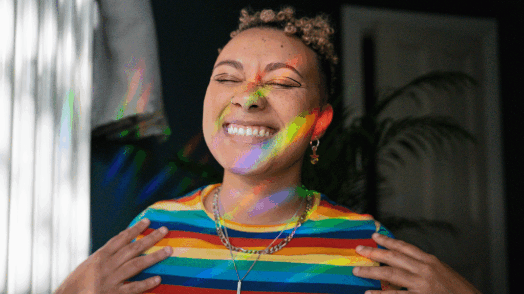 A woman smiling with her eyes closed