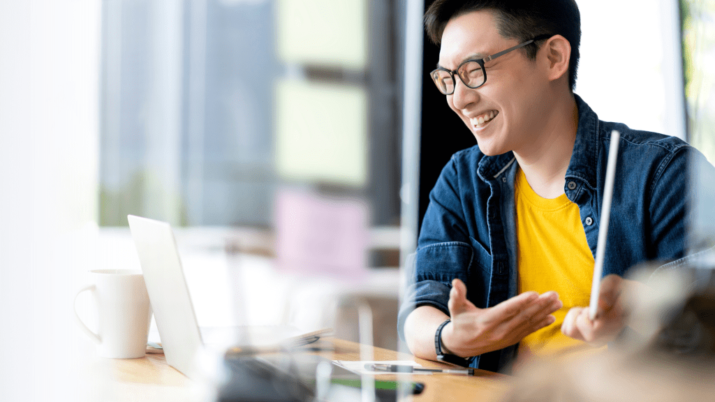 Asian man doing an online video presentation.